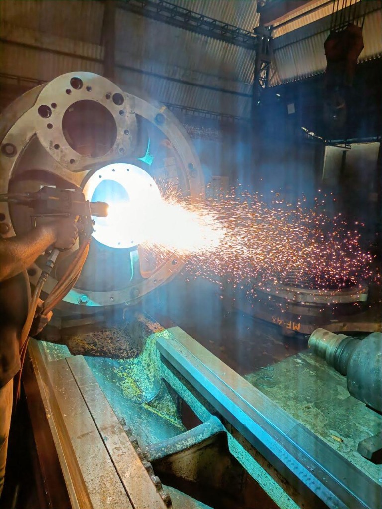 Sparks from thermal spray gun